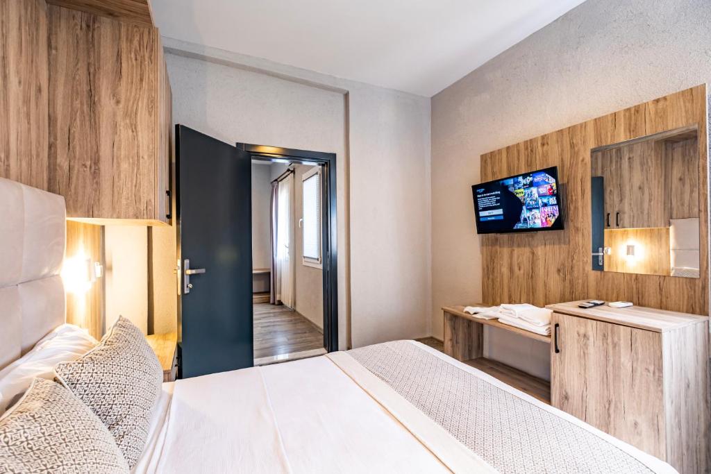 A bed or beds in a room at Hotel Centro Bodrum