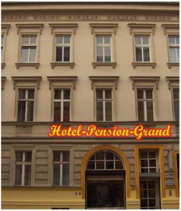 a hotel fashion guard sign in front of a building at Hotel-Pension Grand in Berlin