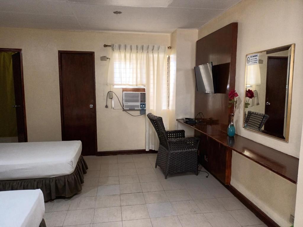 Postel nebo postele na pokoji v ubytování Mactan Pension House