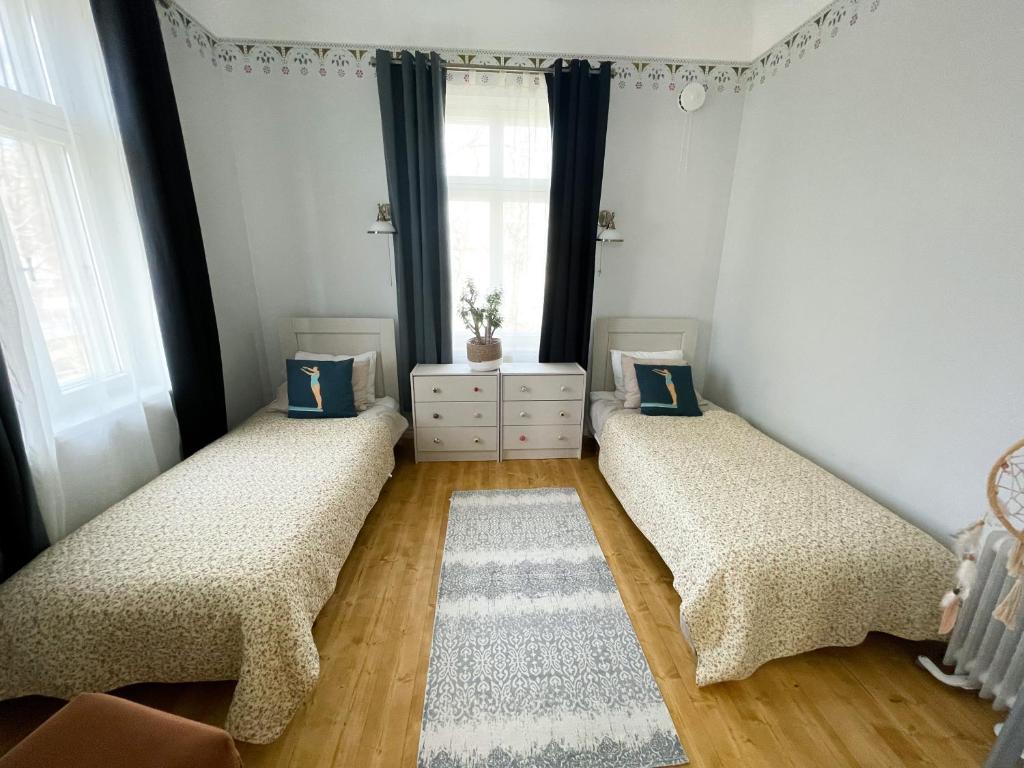 Postel nebo postele na pokoji v ubytování Spacious Supeluse Apartment