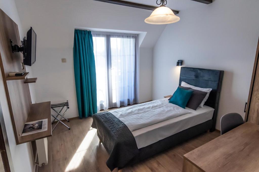Postel nebo postele na pokoji v ubytování Hotel Bacchus