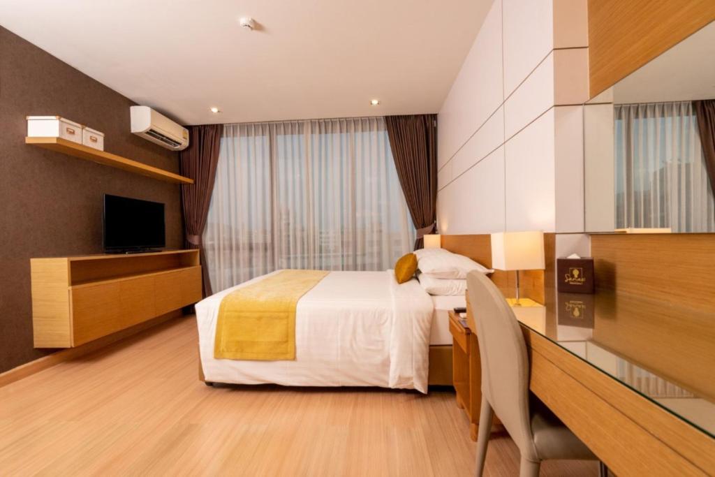 Postel nebo postele na pokoji v ubytování Sanae' Hotel Nimman