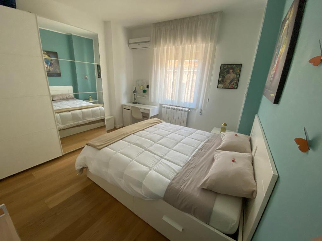 Posteľ alebo postele v izbe v ubytovaní Appartamento di lusso in centro storico Palermo