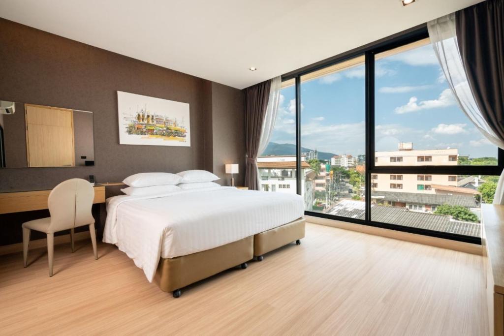 Postel nebo postele na pokoji v ubytování Sanae' Hotel Nimman