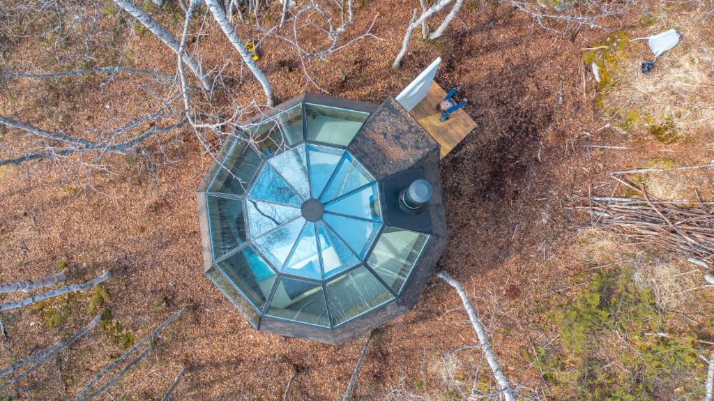 an overhead view of a building in the woods at Environmental friendly Ecolodge in Haugen