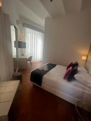 Postel nebo postele na pokoji v ubytování Hotel Gabriella