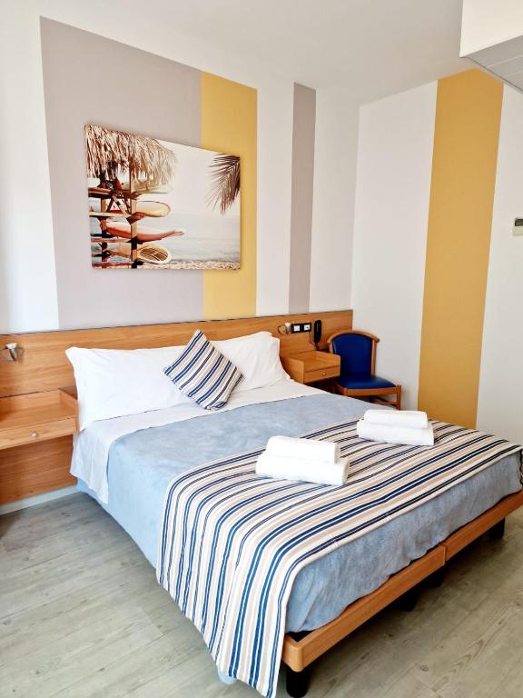 Postel nebo postele na pokoji v ubytování Hotel Orchidea