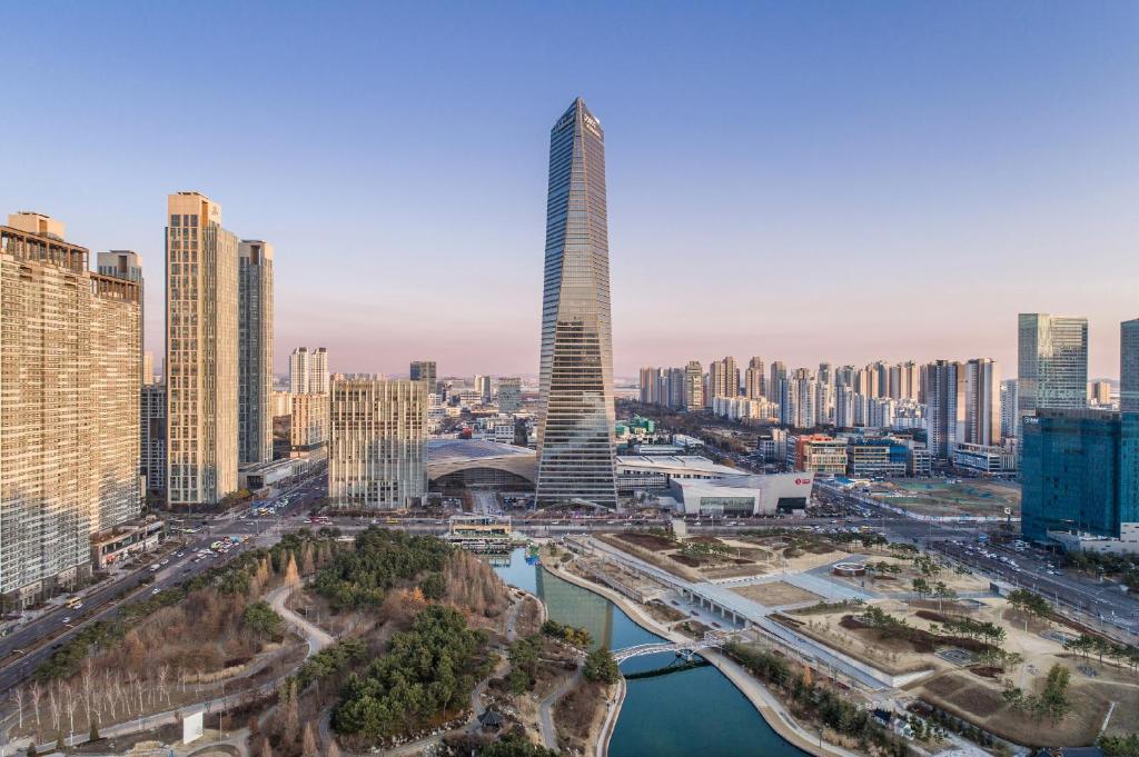 an aerial view of a city with a tall skyscraper at Oakwood Premier Incheon in Incheon