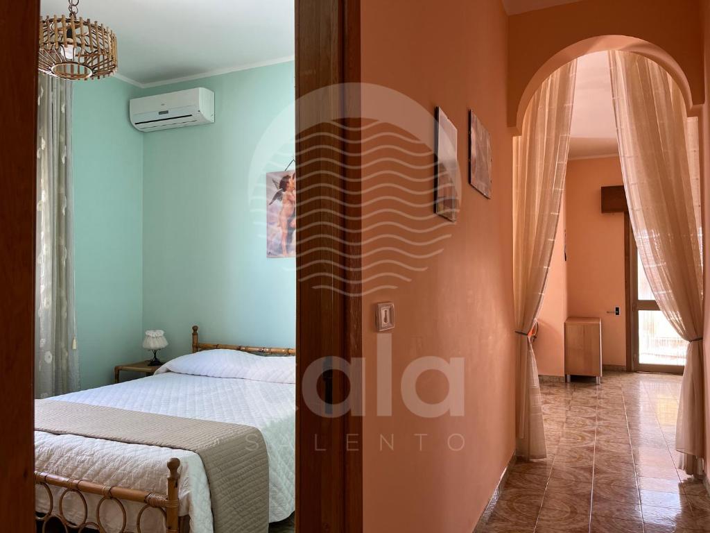 Łóżko lub łóżka w pokoju w obiekcie Villa Corallo By Cala Salento