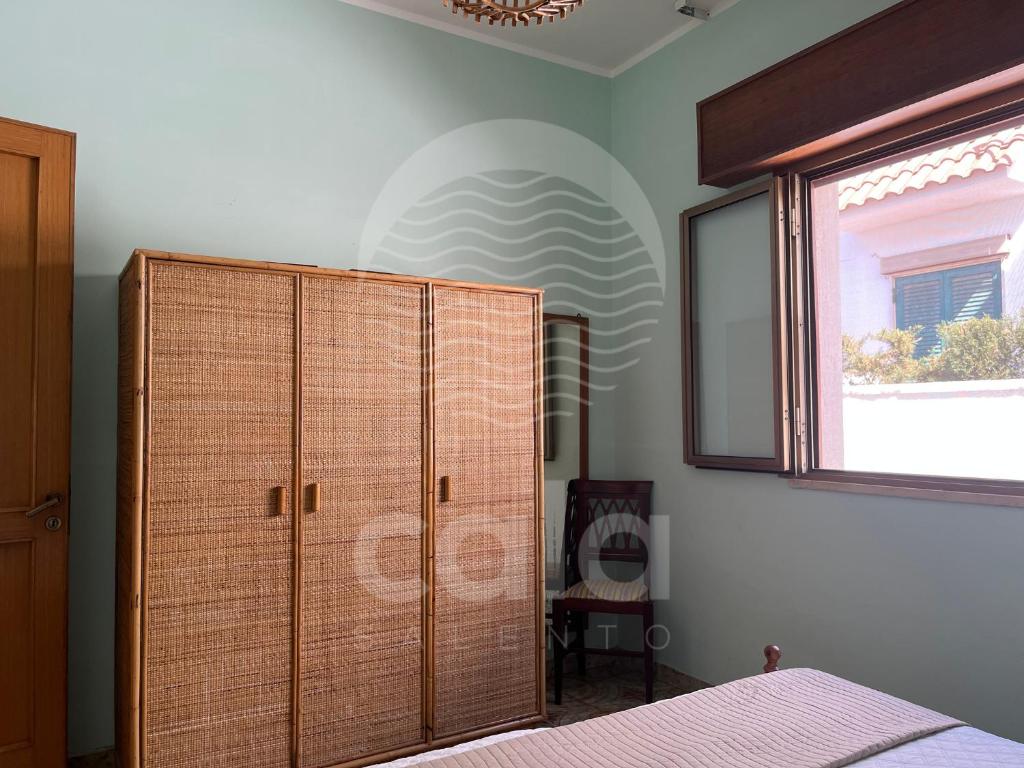 Łóżko lub łóżka w pokoju w obiekcie Villa Corallo By Cala Salento