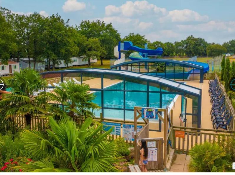 a large swimming pool in a resort at Coeur de Vendée mobil home in La Boissière-de-Montaigu