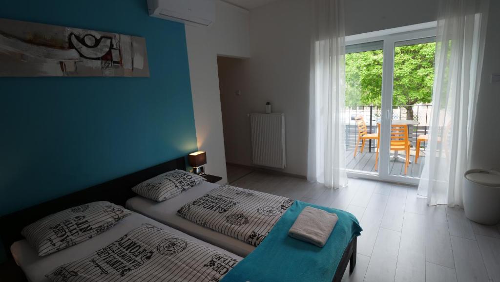 Posteľ alebo postele v izbe v ubytovaní Anna Villa Füred Boutique Rooms