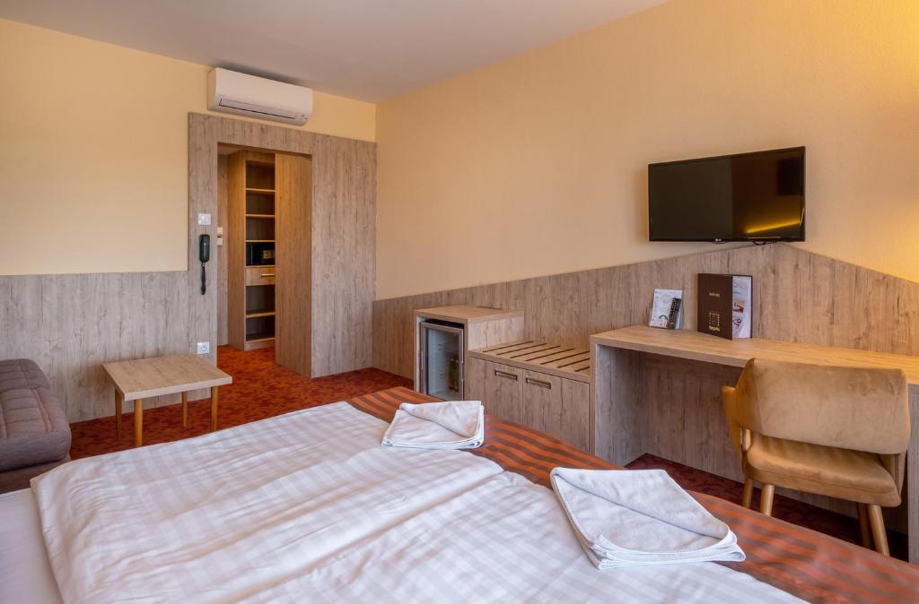 Postel nebo postele na pokoji v ubytování Hotel Margareta