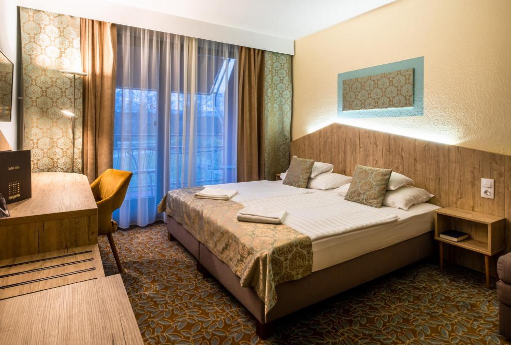 Postel nebo postele na pokoji v ubytování Hotel Margareta