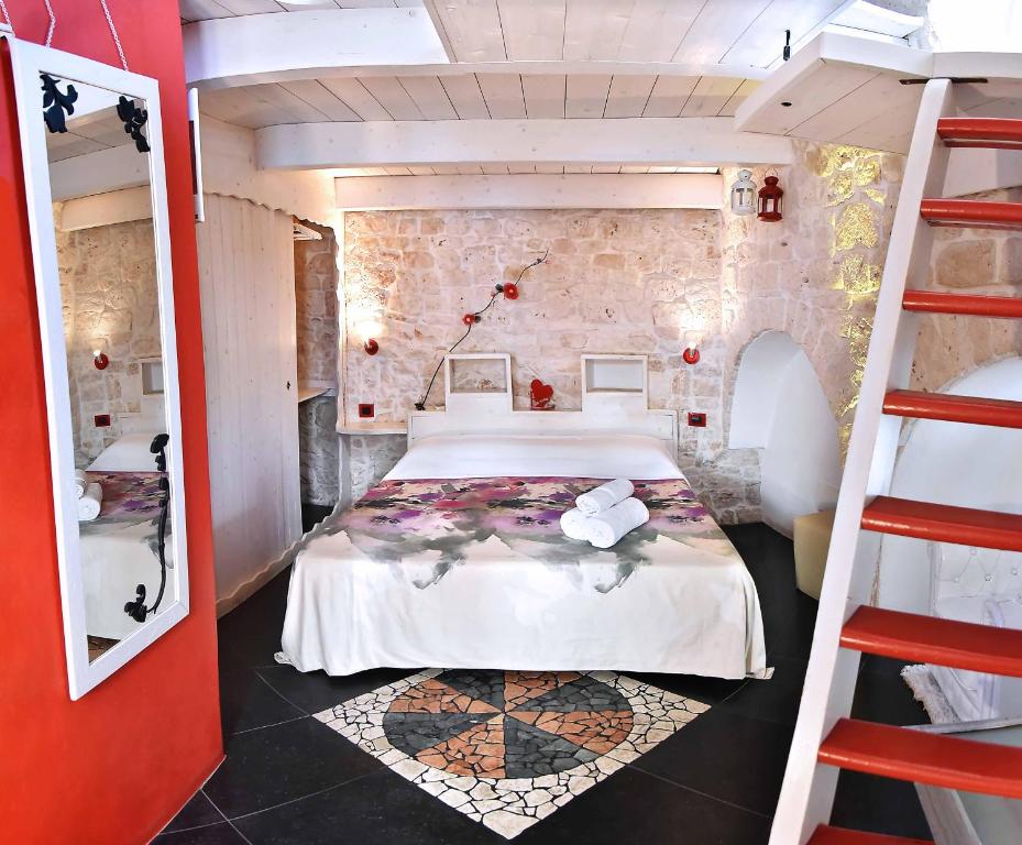 Postel nebo postele na pokoji v ubytování L'Angolo di Gaudì, casa Milà