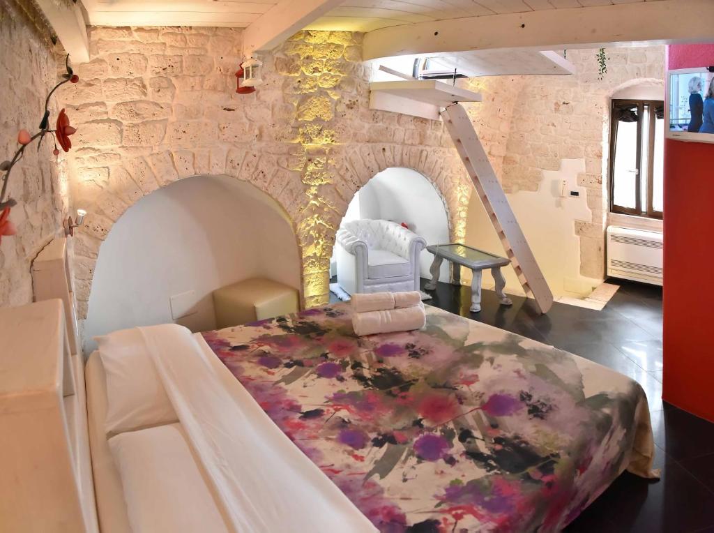 Postel nebo postele na pokoji v ubytování L'Angolo di Gaudì, casa Milà