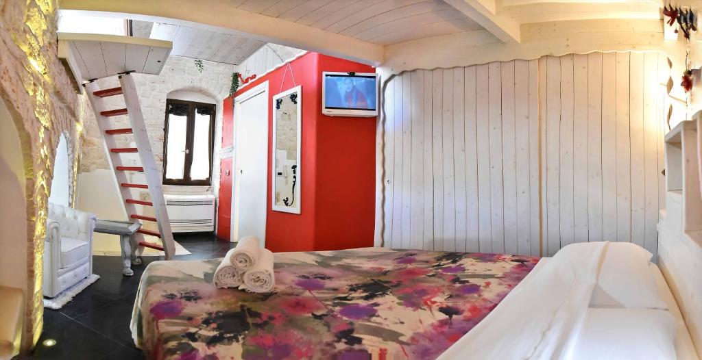 TV a/nebo společenská místnost v ubytování L'Angolo di Gaudì, casa Milà