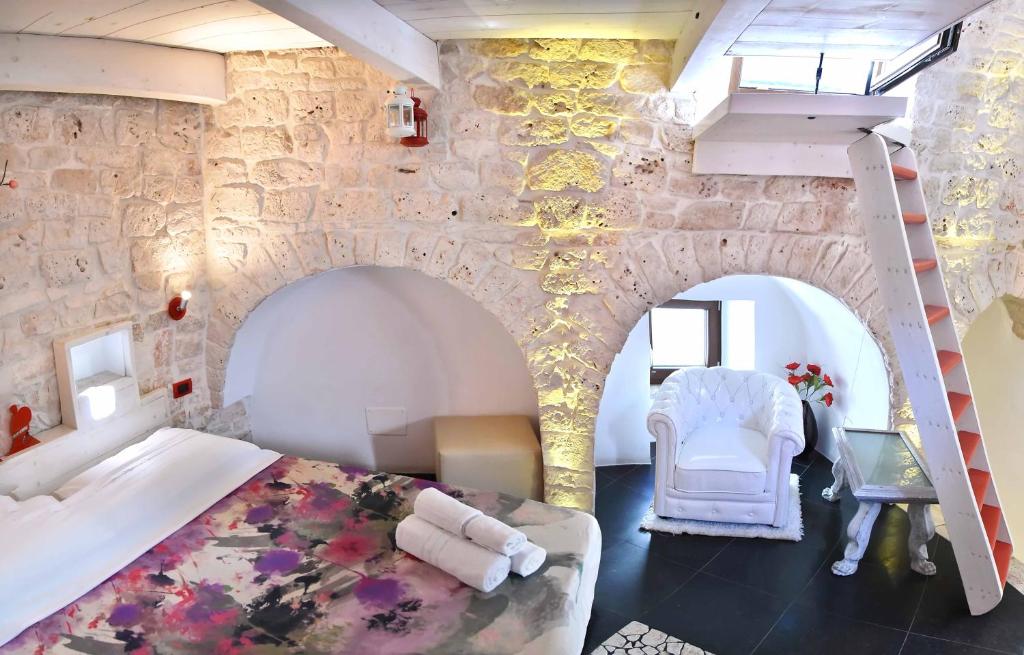 Postel nebo postele na pokoji v ubytování L'Angolo di Gaudì, casa Milà
