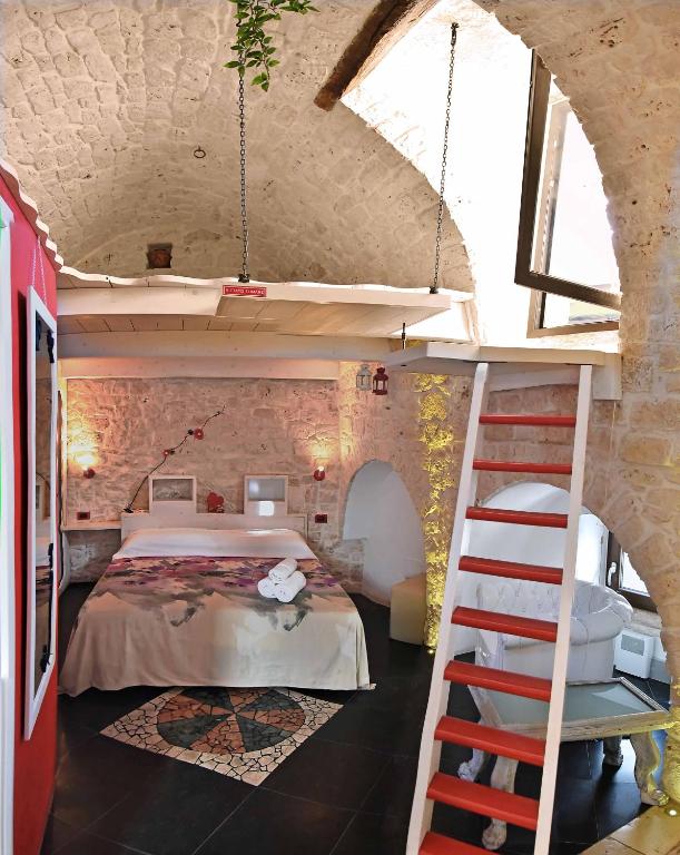 Postel nebo postele na pokoji v ubytování L'Angolo di Gaudì, casa Milà