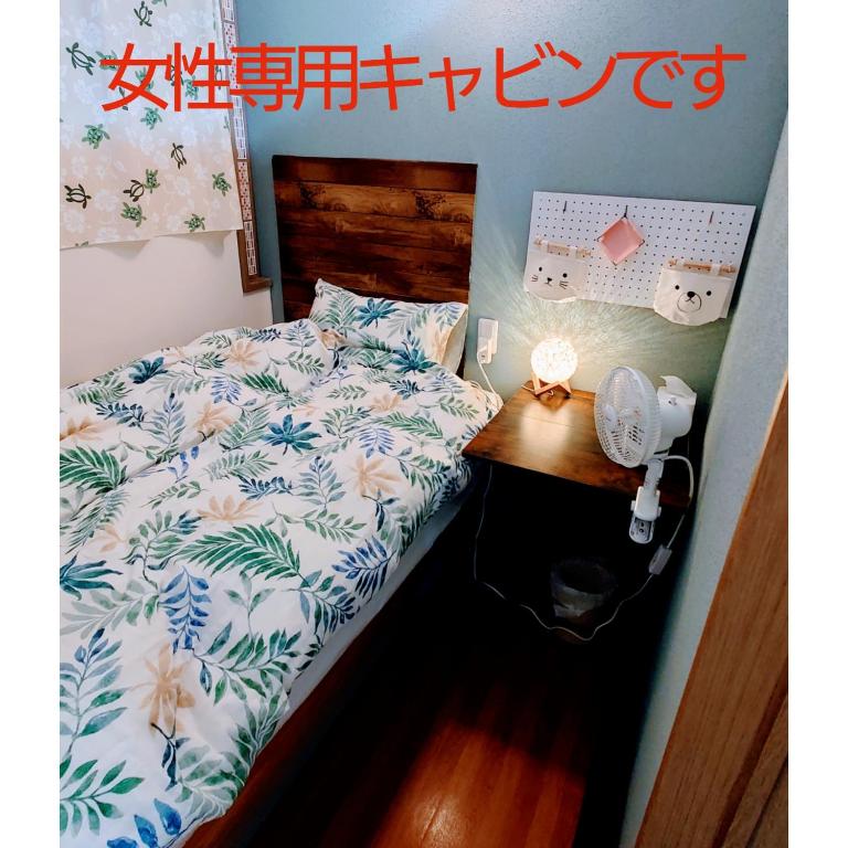Postel nebo postele na pokoji v ubytování 宿 inn TEK-TEK