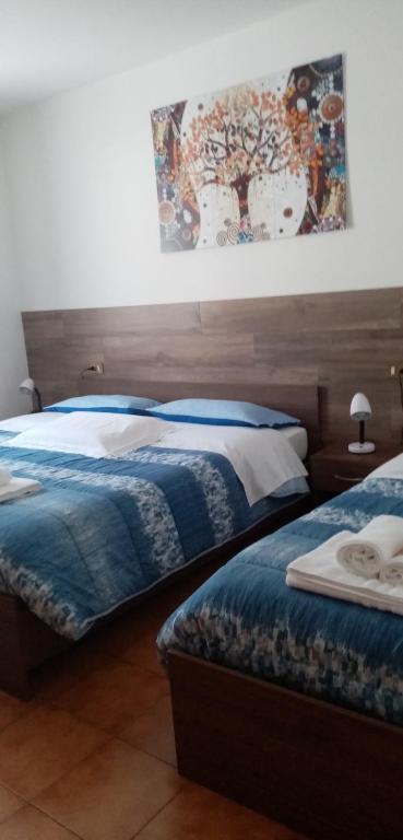 A bed or beds in a room at Al Portec