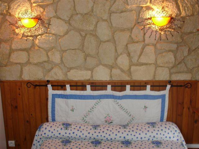 Postel nebo postele na pokoji v ubytování Domaine Manos