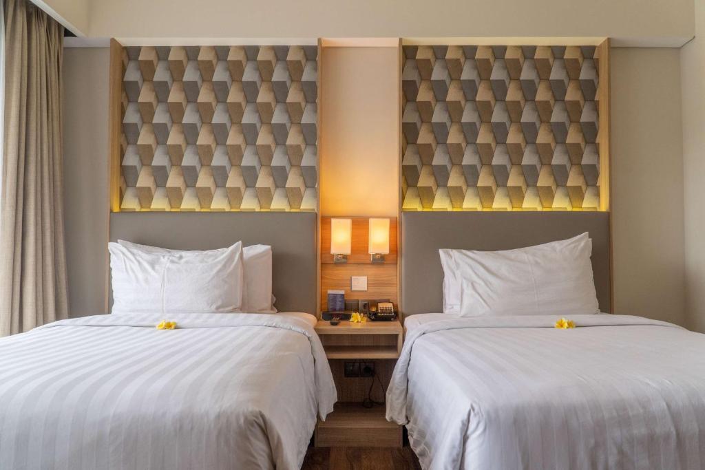 Postel nebo postele na pokoji v ubytování Best Western Kamala Jimbaran
