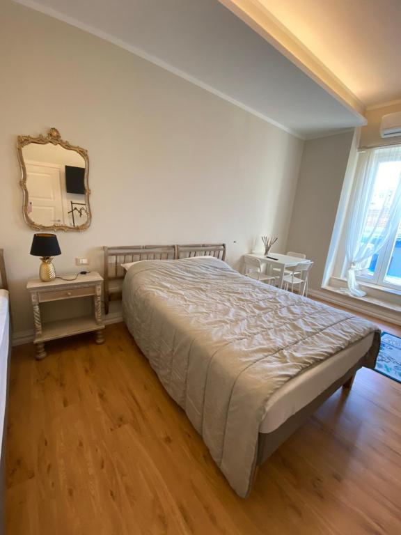 Postel nebo postele na pokoji v ubytování Affittacamere VIA ROMA 12