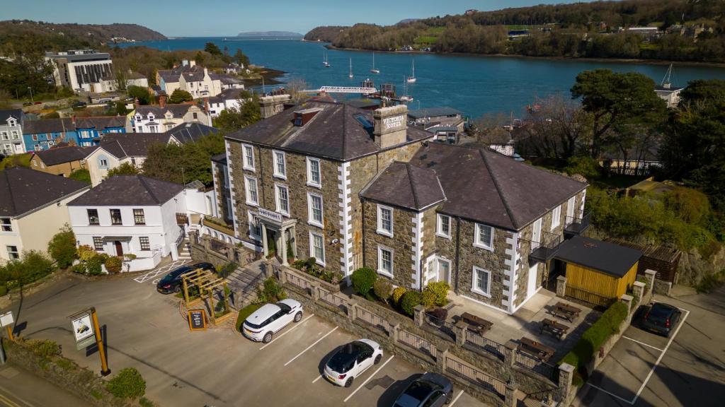 an aerial view of a large building with cars parked in a parking lot at Victoria Hotel by Chef & Brewer Collection in Menai Bridge