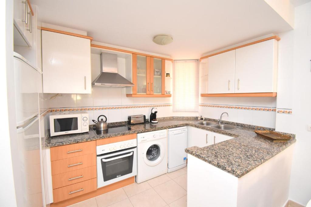 Kuchyň nebo kuchyňský kout v ubytování Apartamento Nou Fontana Javea