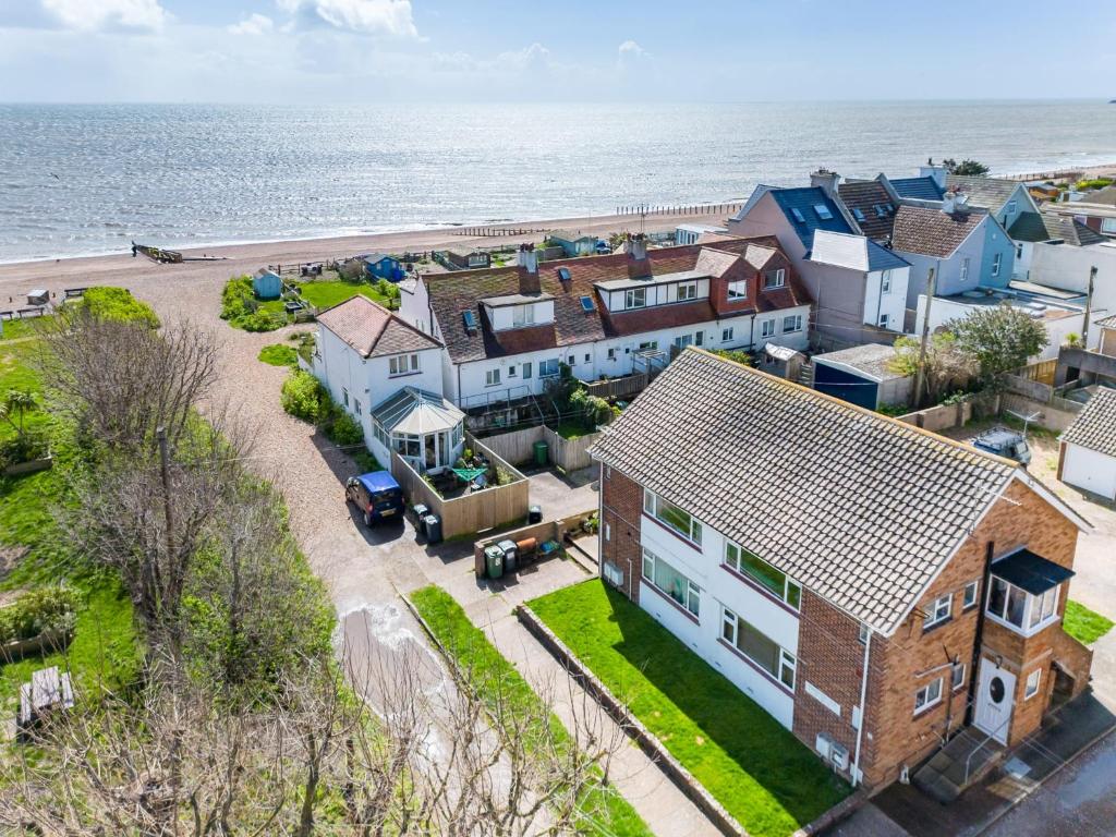 an aerial view of a house with the ocean in the background at Quaint 2 Bed Village Retreat in Pevensey