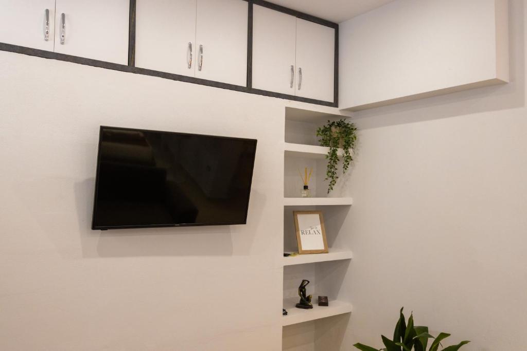 TV a/nebo společenská místnost v ubytování Toni's studios