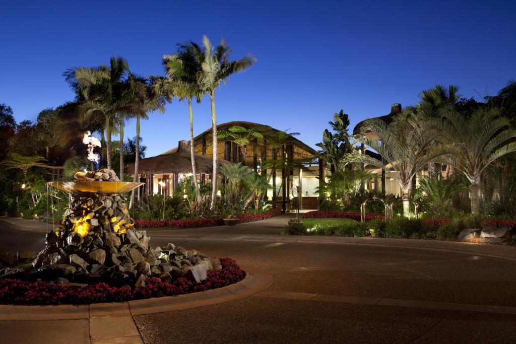 a fountain in the middle of a street with palm trees at Paradise Point Resort & Spa in San Diego