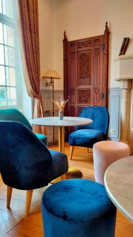 Posezení v ubytování Hôtel Château de l'Hermitage