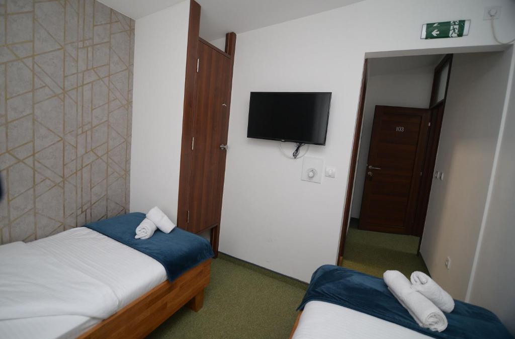 Postel nebo postele na pokoji v ubytování Apartmani Čarolija