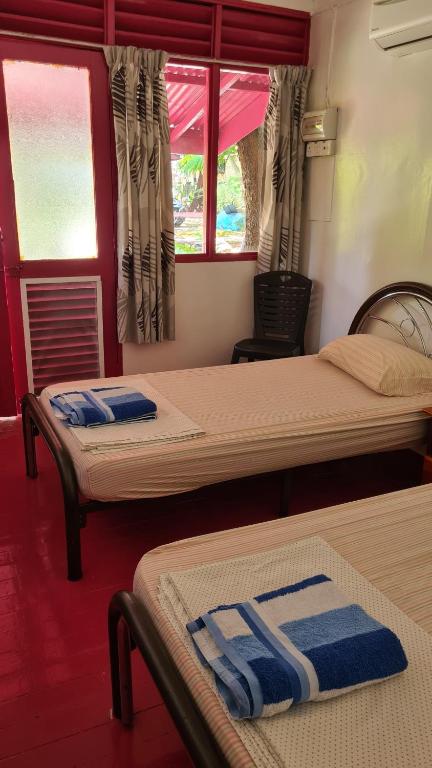 Voodi või voodid majutusasutuse Gecko Guesthouse toas