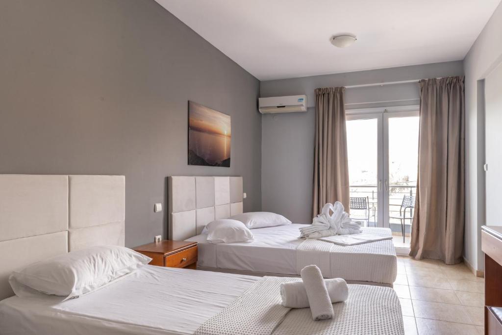 Postel nebo postele na pokoji v ubytování Atrium Hotel