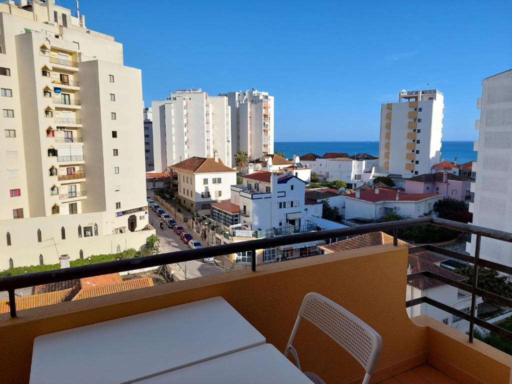 a balcony with a view of a city at Alltravel Columbia apartment in Portimão