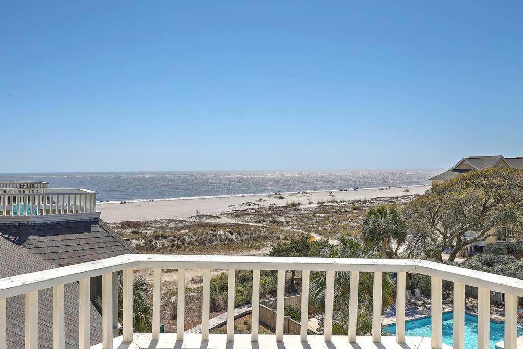 a view of the beach from the balcony of a beach house at Port O' Call E302 - Top Floor Ocean View Condo! in Isle of Palms