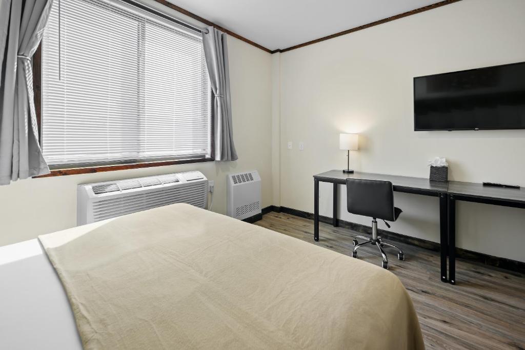 TV a/nebo společenská místnost v ubytování Highbridge Hotel