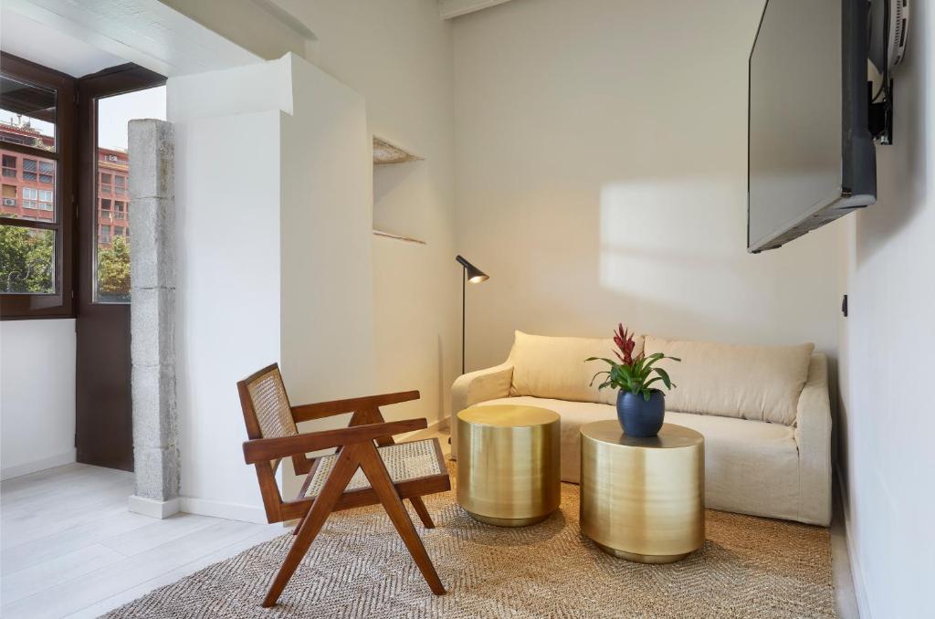 TV a/nebo společenská místnost v ubytování Canvas Apartments & Lofts Girona