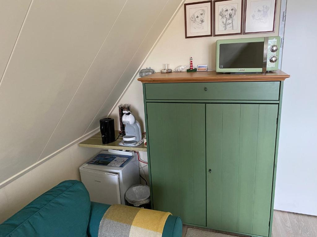 TV a/nebo společenská místnost v ubytování Rose Cottage B&B