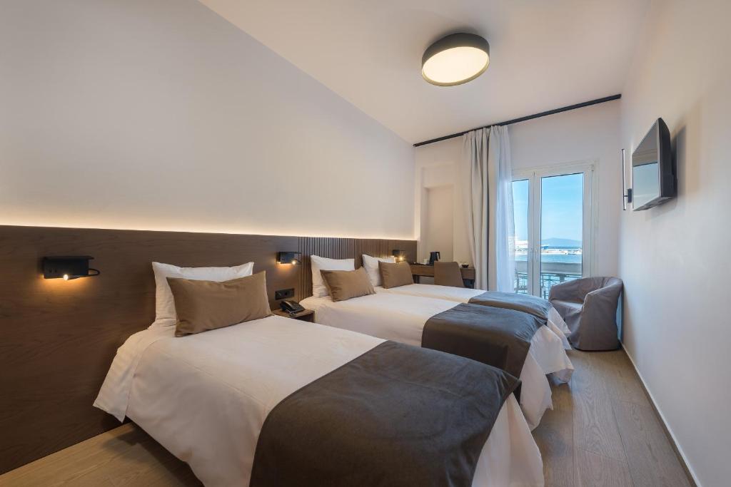 Postel nebo postele na pokoji v ubytování Lesvion Hotel