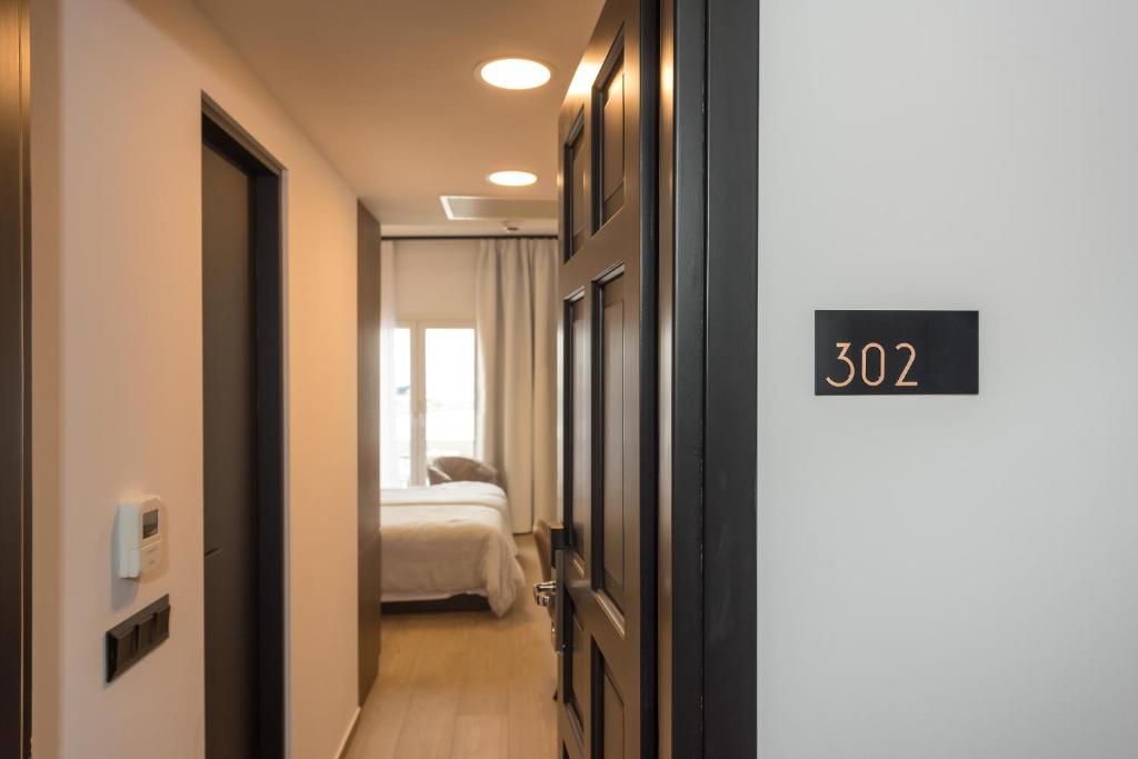 Postel nebo postele na pokoji v ubytování Lesvion Hotel