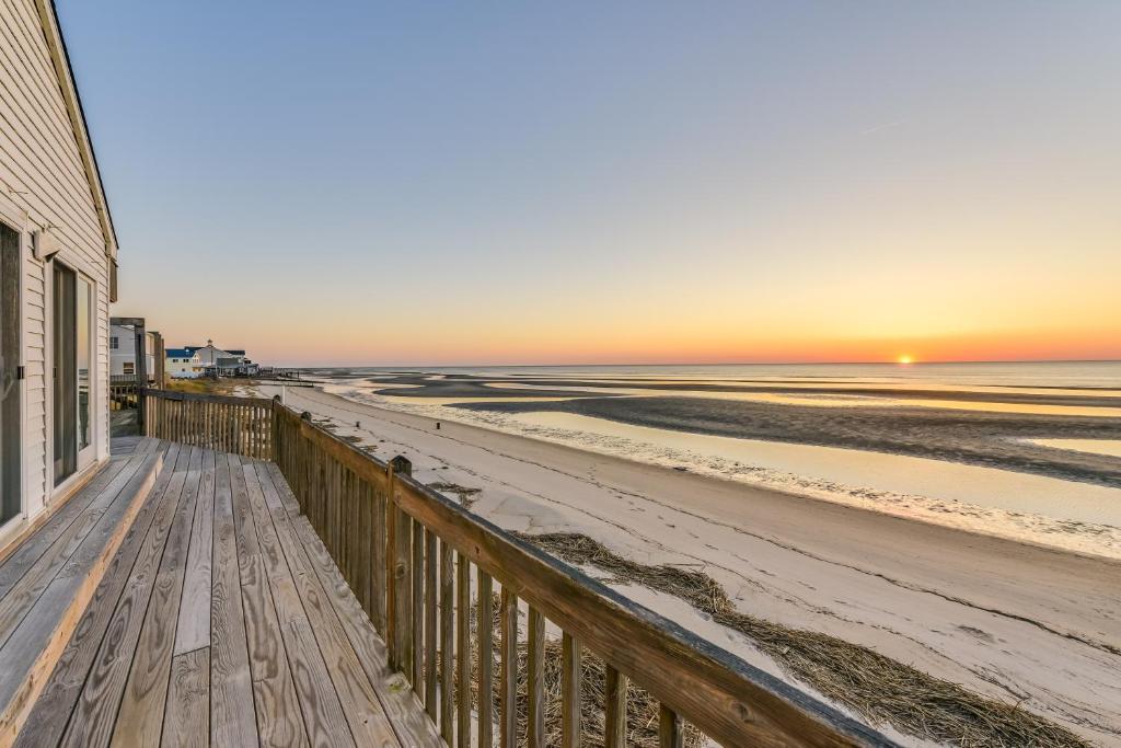 a view of the beach at sunset from a deck at Cape May Vacation Rental with Panoramic Ocean Views! in Cape May Court House