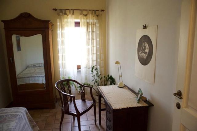 A bed or beds in a room at Il Casale di Aquarubra