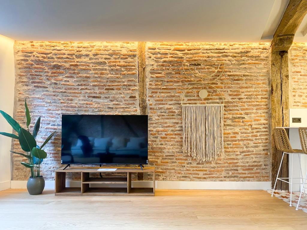 TV a/nebo společenská místnost v ubytování Ribera AC by Staynnapartments