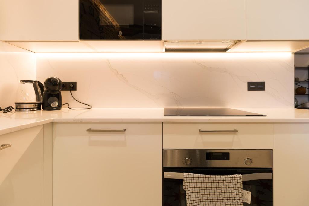 Kuchyň nebo kuchyňský kout v ubytování Ribera AC by Staynnapartments