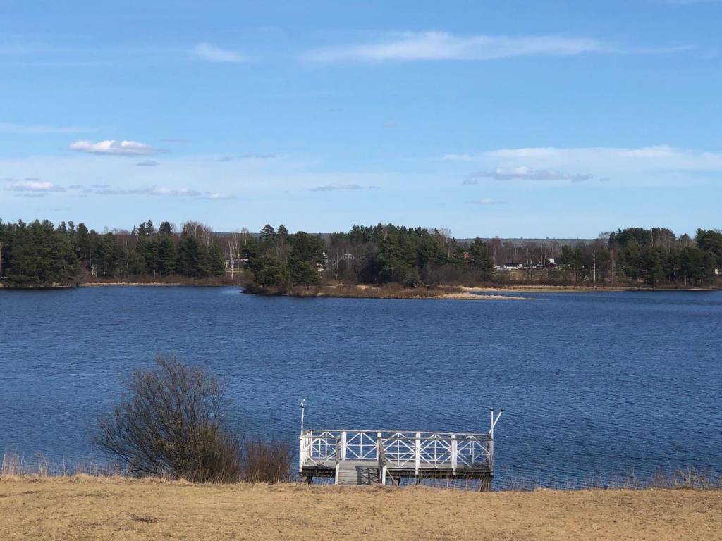 a dock in the middle of a large lake at Anna Gården, App. D in Ytterhogdal