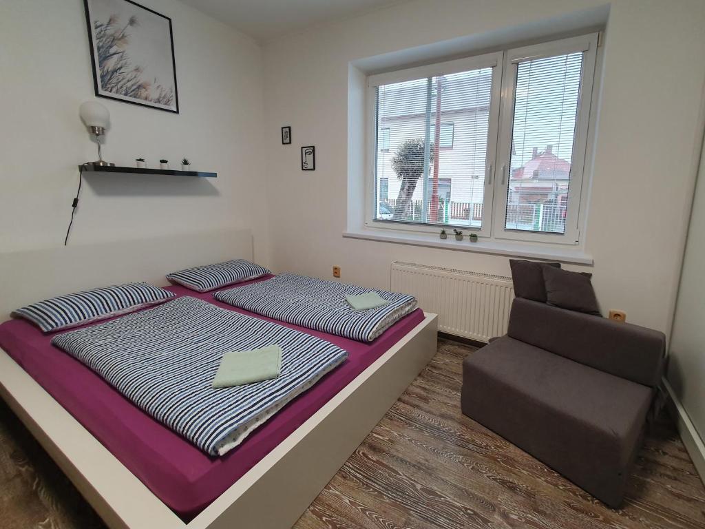 Postel nebo postele na pokoji v ubytování Apartmán U Jakuba